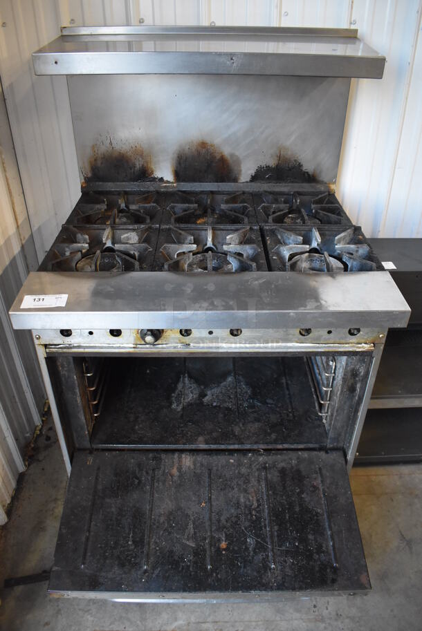 Bakers Pride Stainless Steel Commercial Natural Gas Powered 6 Burner Range w/ Oven, Over Shelf and Back Splash on Commercial Casters. Oven Door Does Not Stay Closed. 36x34x57 - Image 1 of 7