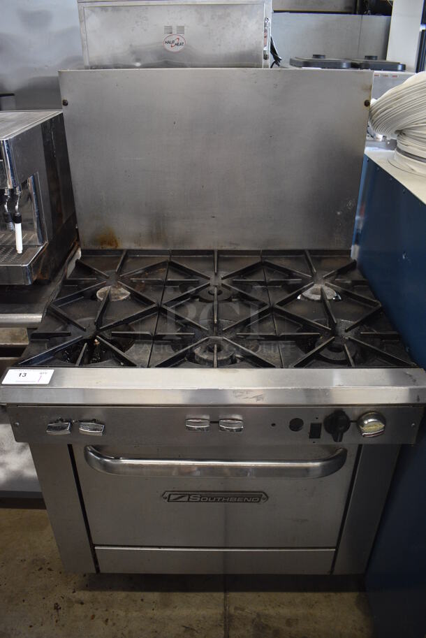 Southbend Stainless Steel Commercial Natural Gas Powered 6 Burner Range w/ Oven and Backsplash. 36x34x60