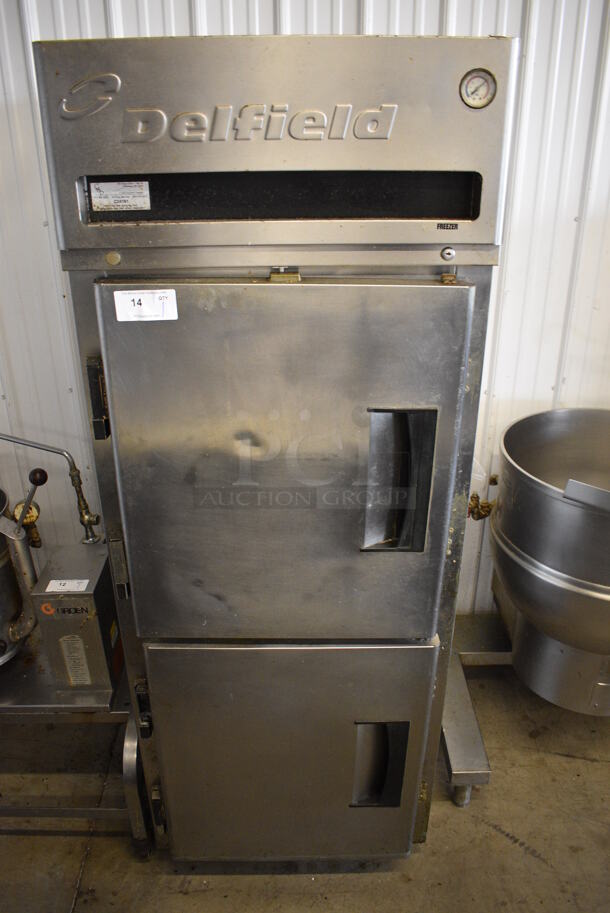Delfield Model MFR1-SH Stainless Steel Commercial 2 Half Size Door Reach In Freezer w/ Poly Coated Racks on Commercial Casters. 115 Volts, 1 Phase. 29x34x79. Tested and Powers On But Temps at 45 Degrees