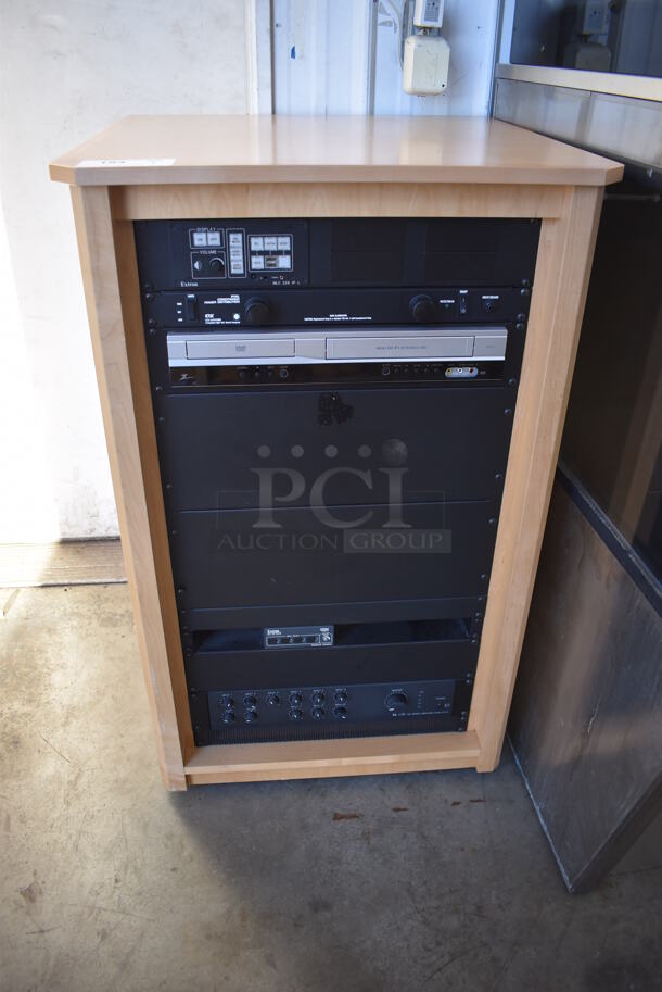 AV Rack w/ Extron MLC 226 IP L, Zenith DVD Player, Extron MLS 100 Series MediaLink Switcher, TOA 700 Series Amplifier on Commercial Casters. 25.5x25.5x41
