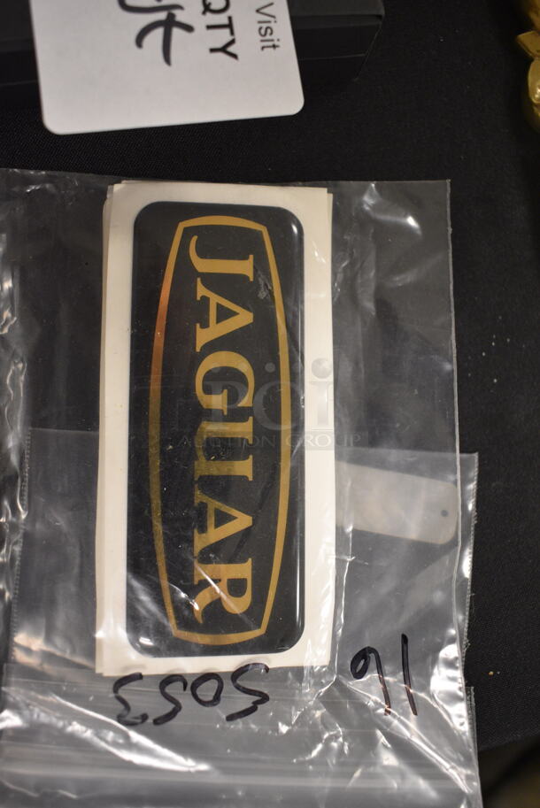 ALL ONE MONEY! Jaguar Stickers, Gold Colored Key, Aston Martin License Plate Holder, and Lamborghini Cuff Links with Box - Image 2 of 6