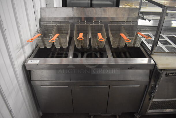 2011 Dean SCFSM350GNS Stainless Steel Commercial Floor Style Natural Gas Powered 3 Bay Deep Fat Fryer w/ 6 Metal Fry Baskets and Filtration System on Commercial Casters. 105,600 BTU. 47x30x51