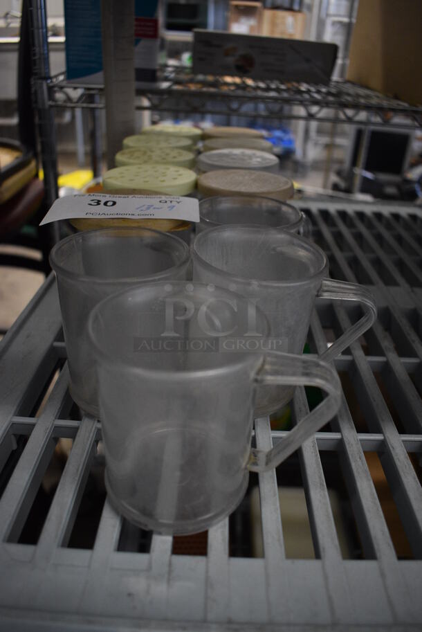 ALL ONE MONEY! Lot of 13 Clear Poly Seasoning Shakers w/ 9 Lids. 4x3x3.5 - Image 1 of 3