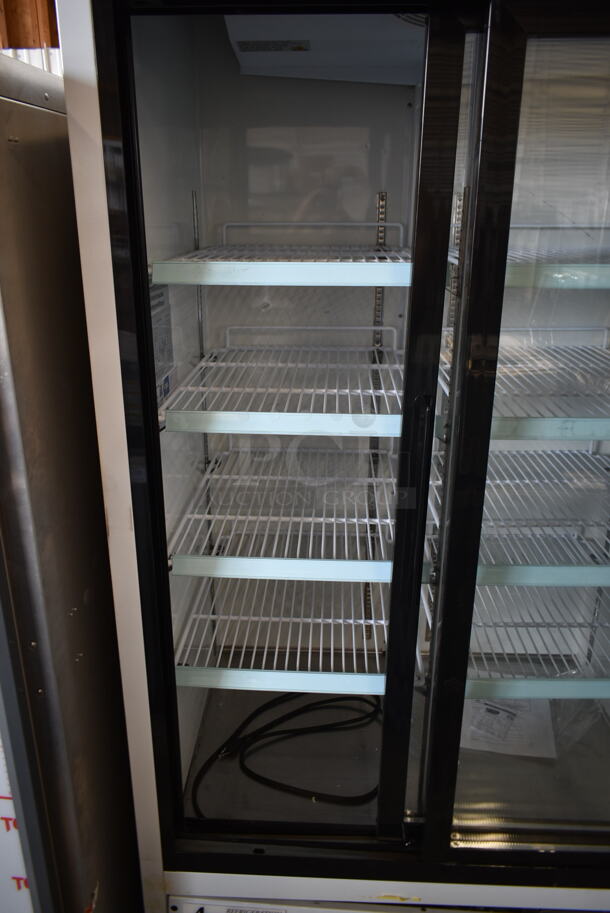 BRAND NEW SCRATCH AND DENT! 2023 Avantco 178GDS33HCW Metal Commercial 2 Door Reach In Cooler Merchandiser w/ Poly Coated Racks on Commercial Casters. 115 Volts, 1 Phase. Cannot Test Due To Cut Power Cord - Image 6 of 9