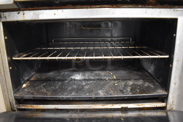 Imperial Stainless Steel Commercial Natural Gas Powered 4 Burner Range, Flat Top Griddle, Oven, Over Shelf and Back Splash on Commercial Casters. 60x31x57 - Image 6 of 7