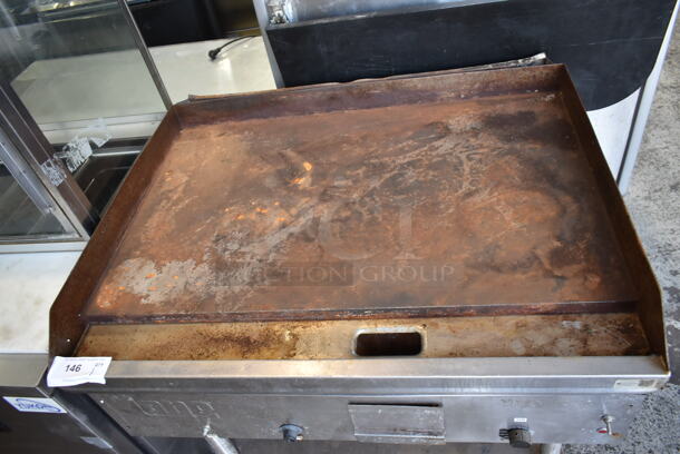 Lang G-3E Stainless Steel Commercial Natural Gas Powered Flat Top Griddle w/ Metal Under Shelf on Commercial Casters. 27,000 BTU.  - Image 3 of 5