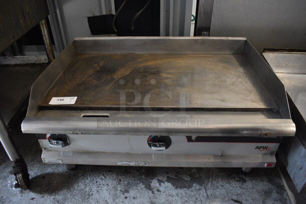 Apw Wyott Commercial Stainless Steel Natural Gas Countertop Griddle on Galvanized Legs.