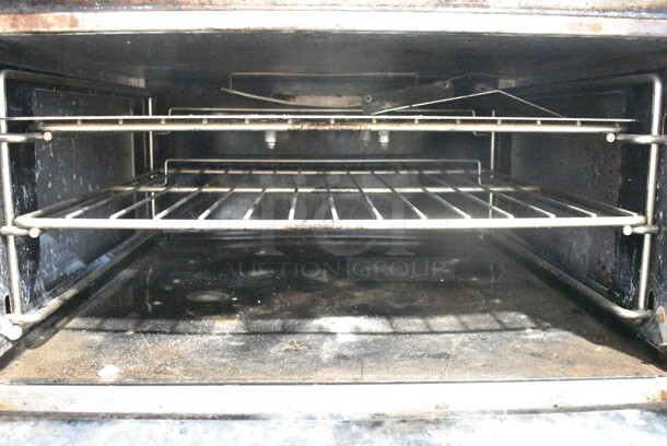 Vulcan V6B36S Stainless Steel Commercial Natural Gas Powered 6 Burner Range w/ Oven on Commercial Casters.  - Image 4 of 6