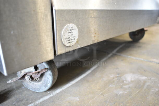 Garland M44R Stainless Steel Commercial Natural Gas Powered 4 Burner Range w/ Oven, Over Shelf and Back Splash on Commercial Casters.  - Image 6 of 9