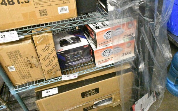 6 Various Items Including Pyle PKSTX5 Piano Stand, 2 Sets of Pyle PLMR692 6" x 9" 2 Way 260 Watt Marine Boat Speakers, Pyle PLDMR27NBK Marine Stereo Receiver Power Amplifier, SereneLife SLHPLPINK30 Hangers, Nutrichef NCCREX42 3Pcs. Nonstick Bakeware Tray Set. 6 Times Your Bid!  - Image 1 of 12