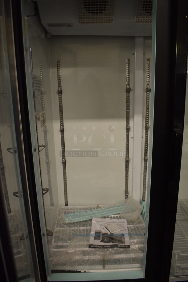 BRAND NEW SCRATCH AND DENT! Avantco 178GDC40HCB Metal Commercial 2 Door Reach In Cooler Merchandiser w/ Poly Coated Racks on Commercial Casters. 115 Volts, 1 Phase. 48x29x85. Tested and Working! - Image 4 of 5