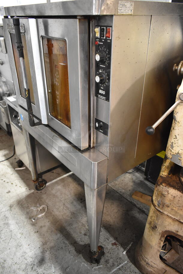 Blodgett BDO-100-G-ES Stainless Steel Commercial Natural Gas Powered Full Size Convection Oven w/ View Through Doors, Metal Oven Racks, Thermostatic Controls and Metal Legs on Commercial Casters.  - Image 2 of 6