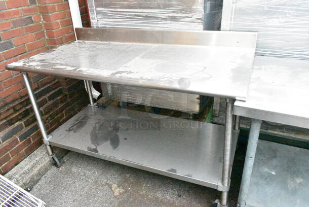 Stainless Steel Table w/ Metal Under Shelf, Drawer and Back Splash on Commercial Casters.  - Image 1 of 4