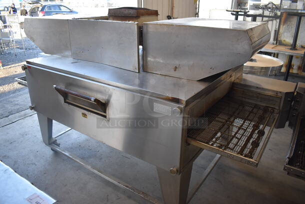XLT 3270 Stainless Steel Commercial Natural Gas Powered Conveyor Pizza Oven on Commercial Casters. Comes w/ Hood / Vent. 180,000 BTU. 113x53x43, 99x37x22 - Image 1 of 8