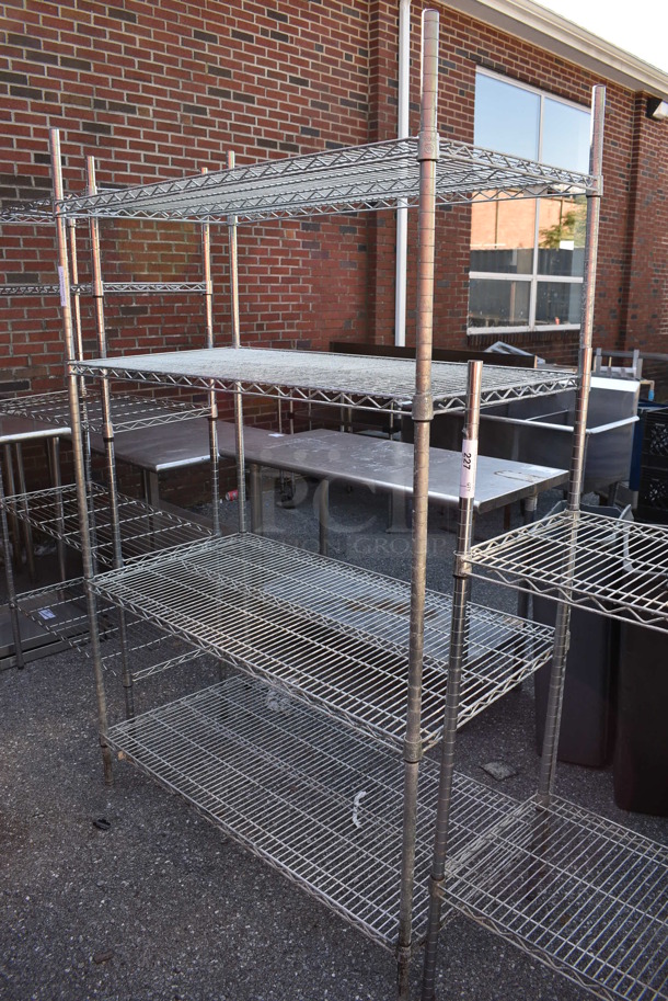 Chrome Finish 4 Tier Shelving Unit. BUYER MUST DISMANTLE. PCI CANNOT DISMANTLE FOR SHIPPING. PLEASE CONSIDER FREIGHT CHARGES. 48x24x75 - Image 1 of 4