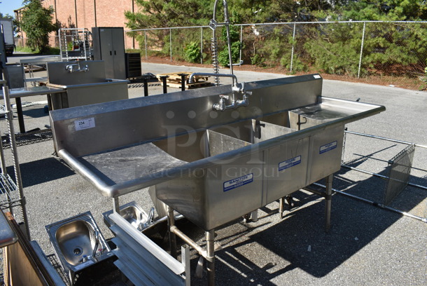Stainless Steel Commercial 3 Bay Sink w/ Dual Drain Boards, Faucet, Handles and Spray Nozzle Attachment. 87x26x44. Bays 16x20x14. Drain Boards 18x22x1