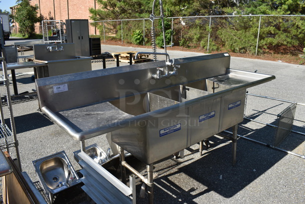 Stainless Steel Commercial 3 Bay Sink w/ Dual Drain Boards, Faucet, Handles and Spray Nozzle Attachment. 87x26x44. Bays 16x20x14. Drain Boards 18x22x1 - Image 1 of 6