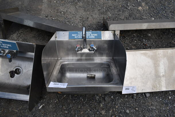 Stainless Steel Single Bay Wall Mount Sink w/ Faucet, Handles and Side Splash Guards.