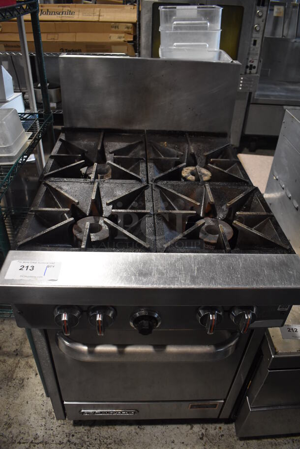 Southbend Stainless Steel Commercial Natural Gas Powered 4 Burner Range w/ Oven and Back Splash on Commercial Casters. 24x34x47