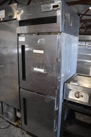 Delfield Stainless Steel Commercial Two Half Size Door Reach In Freezer on Commercial Casters. 115 Volts, 1 Phase. 25.5x32x80. Tested and Working!