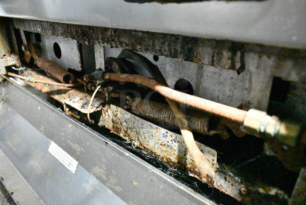 Garland M44R Stainless Steel Commercial Floor Style Natural Gas Powered 4 Burner Range w/ Oven, Over Shelf and Back Splash on Commercial Casters.  - Image 6 of 7