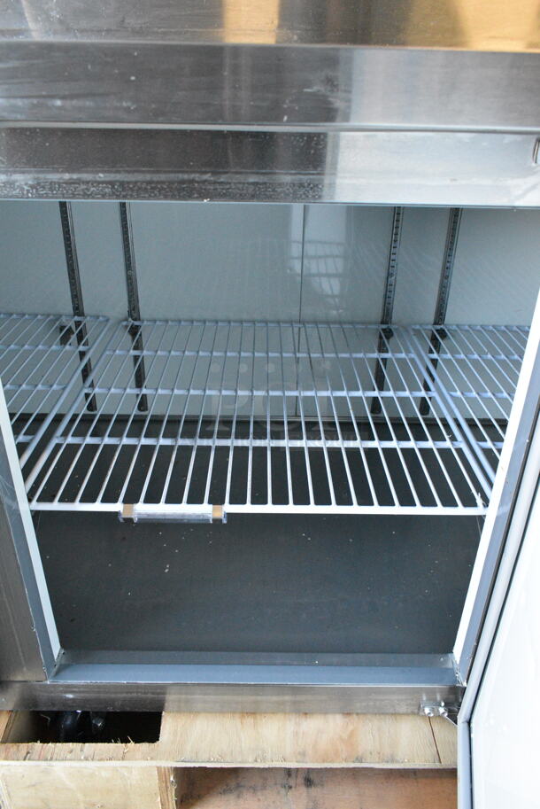 BRAND NEW SCRATCH AND DENT! 2024 Avantco 178APPT91HC Stainless Steel Commercial 3 Door Refrigerated Pizza Prep Table. 115 Volts, 1 Phase. Tested and Working! - Image 4 of 9