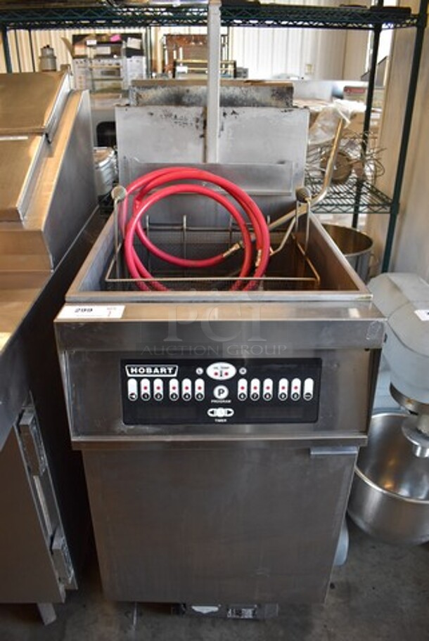 Hobart 1HG85C Stainless Steel Commercial Floor Style Propane Gas Powered Deep Fat Fryer w/ Metal Fry Basket on Commercial Casters. 21x38x57