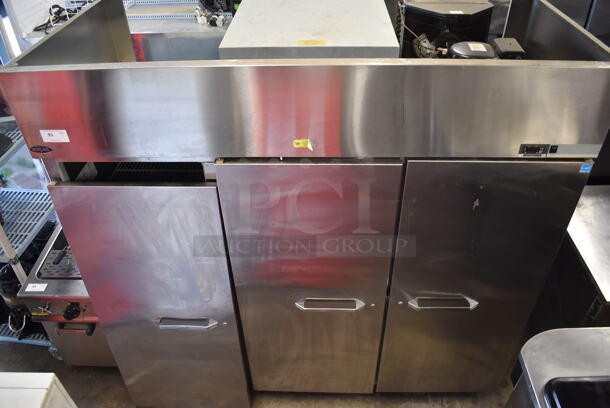 Norlake Commercial Stainless Steel 3 Solid Door Cooler With Polycoated Shelves. One Door Needs 
To Be Re-Attached. 115-230V.  - Image 1 of 7