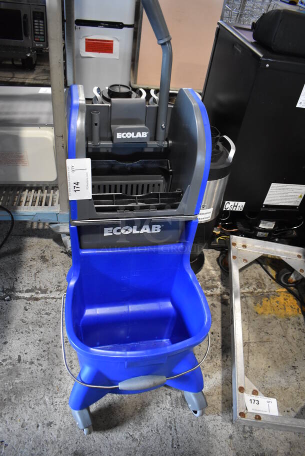 Ecolab Blue and Gray Poly Mop Bucket w/ Wringing Attachment on Commercial Casters. 16x21x39