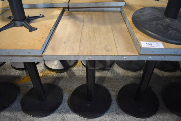 3 Wood Pattern Dining Table on Black Metal Table Bases. 2 Bases Have Damage - See Picture. 18x24x30.5. 3 Times Your Bid!