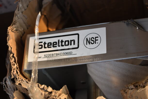 BRAND NEW SCRATCH AND DENT! Steelton 522EBTBKD3060D 30" x 60" 16 Gauge Type 430 Stainless Steel Enclosed Base Sliding Door Table with 4" Backsplash - Image 2 of 2