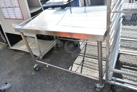 Stainless Steel Table on Commercial Casters. 