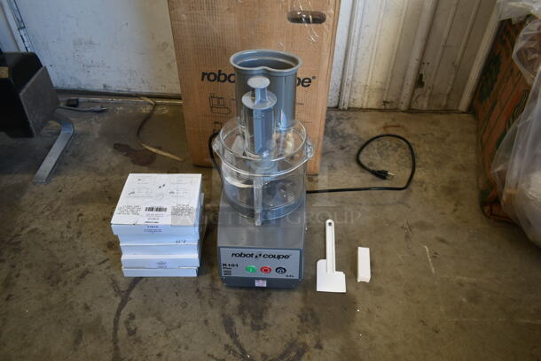 BRAND NEW SCRATCH AND DENT! Robot Coupe R 101 Plus Metal Commercial Countertop Food Processor w/ Bowl, Lid, Pusher, S Blade, 5 New In Box Blades; Julienne, 2 Grater and 2 Slicer. 120 Volts, 1 Phase. Tested and Working!