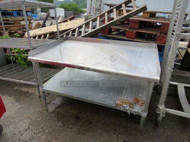 One Stainless Steel Equipment Table With Under Shelf.  49X31X26