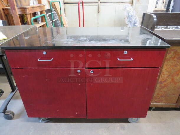One Work Station With A Black Laminate Top, 2 Doors, And 2 Drawers On Casters. 48X25X36 - Image 1 of 3