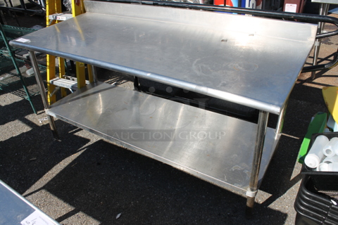 Stainless Steel Table w/ Back Splash and Under Shelf.
