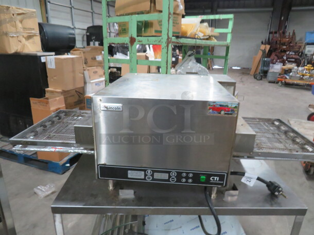 One CTI Lincoln Impinger Conveyor Pizza Oven On A Stainless Steel Table With SS Under Shelf On Casters. Model# 2502HB3U0701620. 240 Volt 1 Phase. Oven 50X32X18. Table 42X26X29. - Image 1 of 7