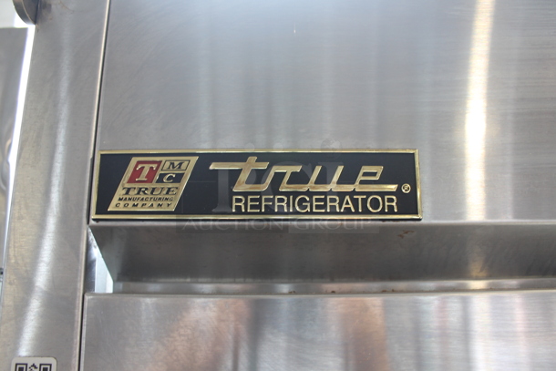 2014 True TG2R-2S ENERGY STAR Stainless Steel Commercial Two Door Reach In Cooler w/ Poly Coated Racks on Commercial Casters. 115 Volts, 1 Phase. Tested and Working! - Image 3 of 9
