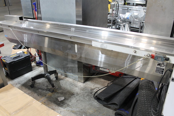 PFM Packaging 30 M Metal Commercial Floor Style Horizontal Form Fill and Seal / Horizontal Flow Wrapper Machine on Commercial Casters. 220 Volts, 1 Phase.  - Image 9 of 11