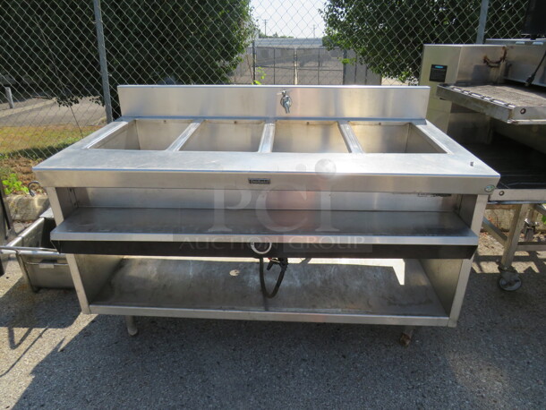 One Stainless Steel Delfield 4 Well Steam Table With Under Shelf. 60X36X41