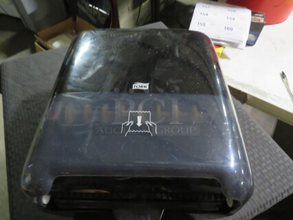 One Tork Automatic Hands Free Paper Towel Dispenser.
