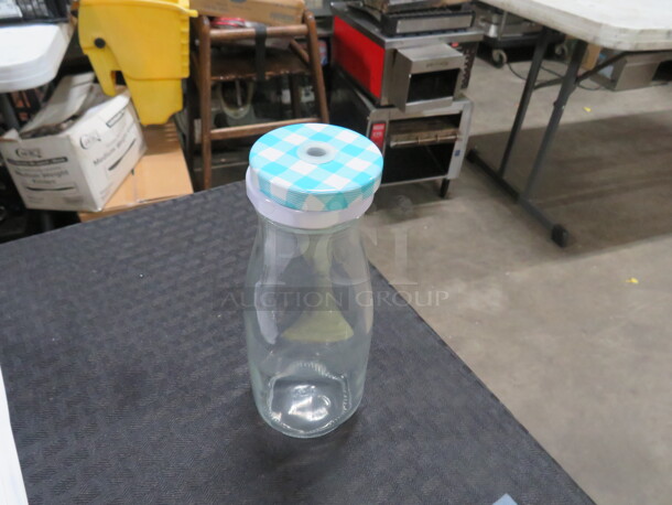 One Lot Of 14 Milk Bottles With Lids. - Image 1 of 1