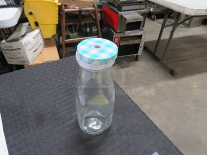 One Lot Of 15 Milk Bottles With Lids.
