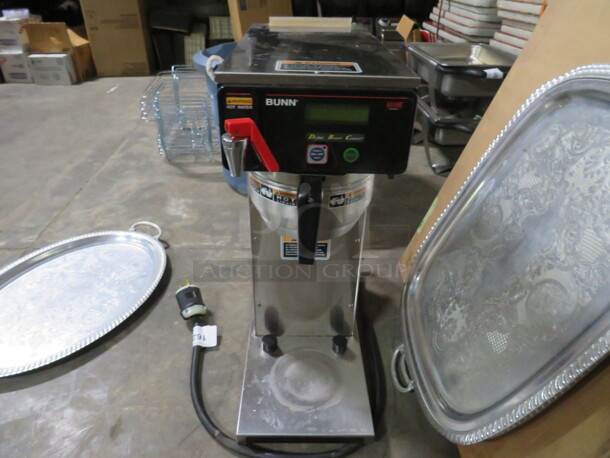 One Bunn Coffee Brewer With Filter Basket. 120 Volt. 1500 Watt. Model# AXIOM DV.