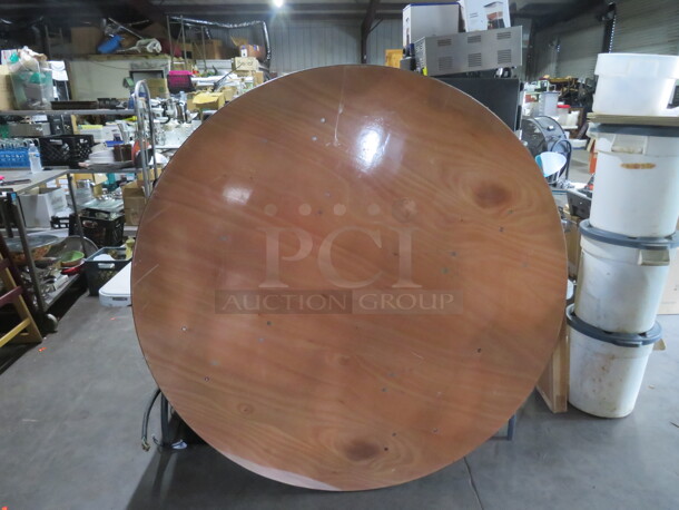 One 60 Inch Round Folding Wooden Banquet/Event Table. - Image 1 of 3