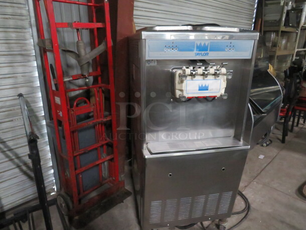 One WORKING Taylor Air Cooled 2 Flavor Twist Soft Serve Machine On Casters. 208-230 Volt. Model# 339-27. 26X33X59 - Image 1 of 3