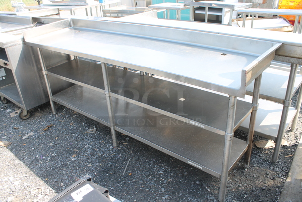 Stainless Steel Commercial Table w/ Back Splash and 2 Under Shelves. - Image 1 of 7