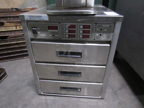One Henny Penny 3 Drawer Heated Cabinet, With Manual. Model# HC-934. 18X24X22
