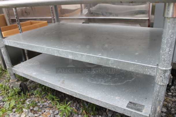 Eagle Stainless Steel Commercial Table w/ Back Splash and 2 Under Shelves on Commercial Casters. - Image 3 of 5