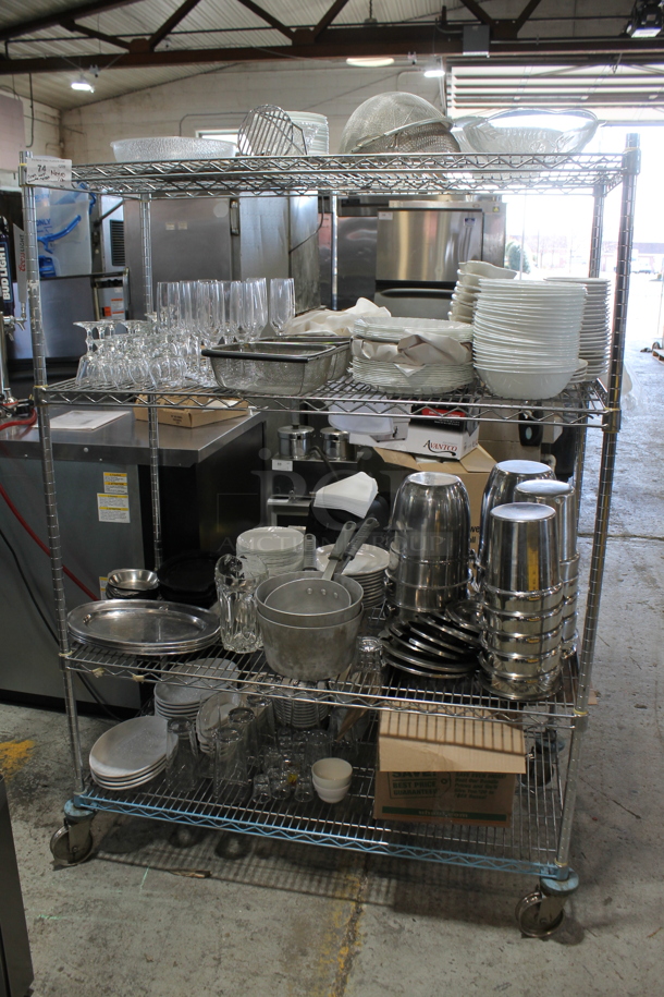 ALL ONE MONEY! Metro Lot of Various Items Including Stainless Steel Ice Buckets, Dishes and Glasses. Metro Shelf Not Included. - Image 1 of 9